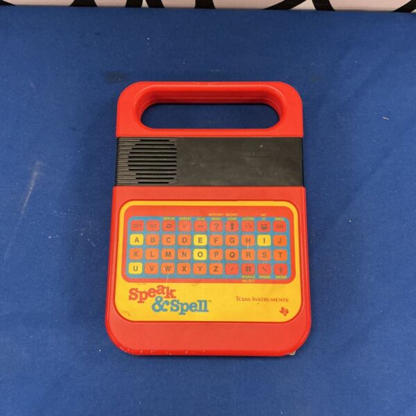 Vintage Texas Instruments Speak and Spell educational toy in orange and black.