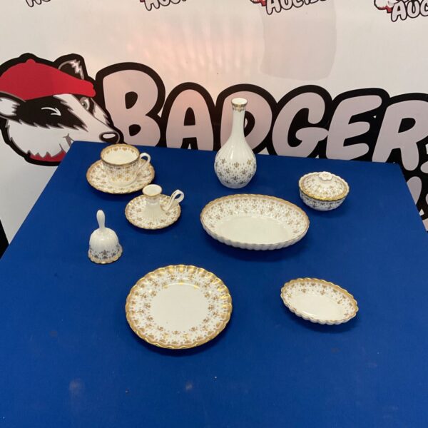 Spode Fleur de Lys china collection with gold accents.
