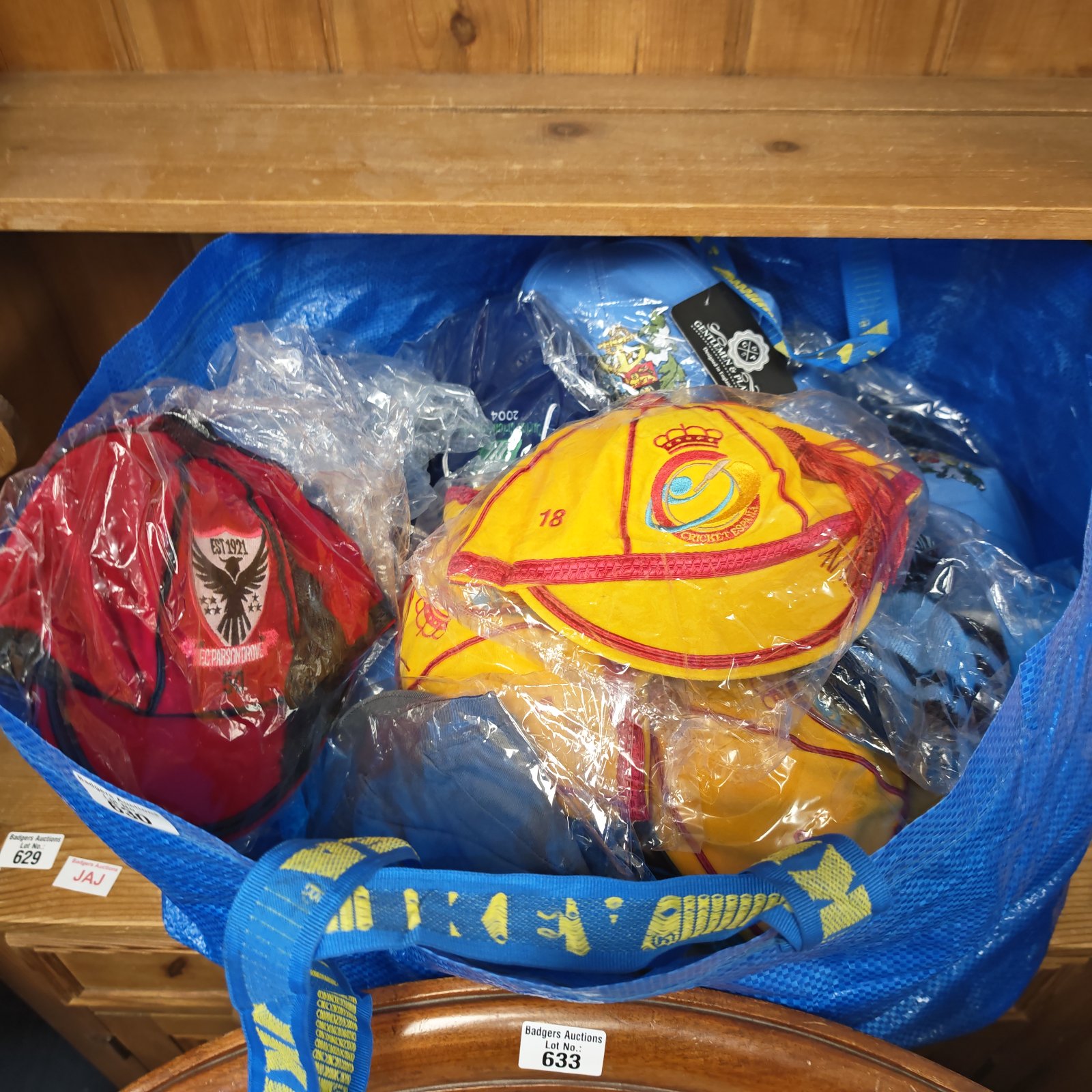Lot of unused sporting caps including cricket Espana and F.C. Parson Drove.