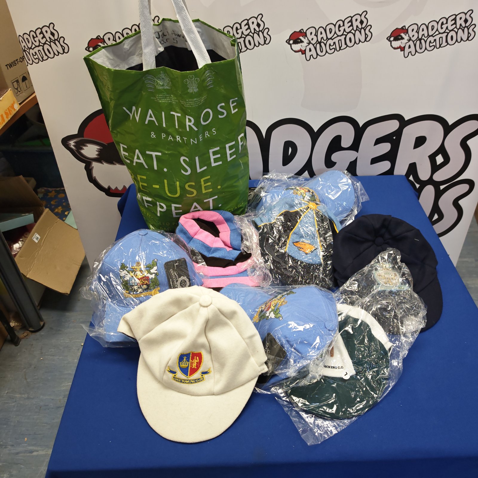 Lot of unused sporting caps in various colours and designs.