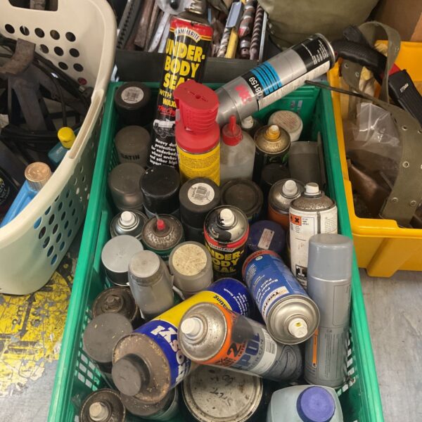 Mixed lot of spray paint cans for DIY and automotive use.