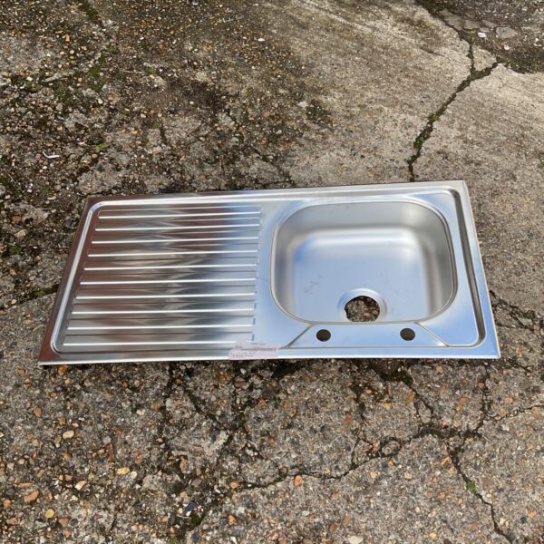 New stainless steel kitchen sink with drainer and single bowl.