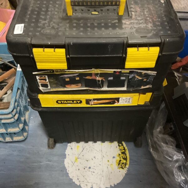 Stanley mobile work centre toolbox with wheels and storage compartments.