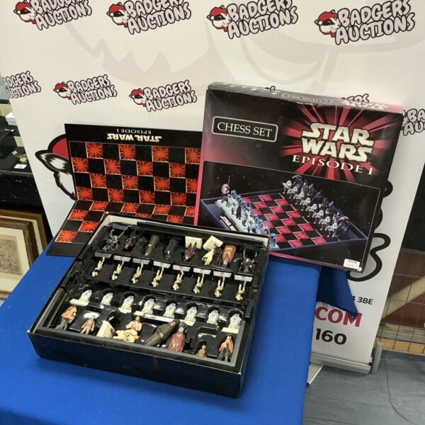 Star Wars Episode 1 chess set with character pieces on a themed board.