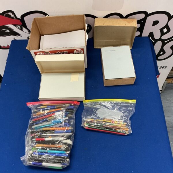 Stationery bundle with pens, pencils, and A5 paper for writing.