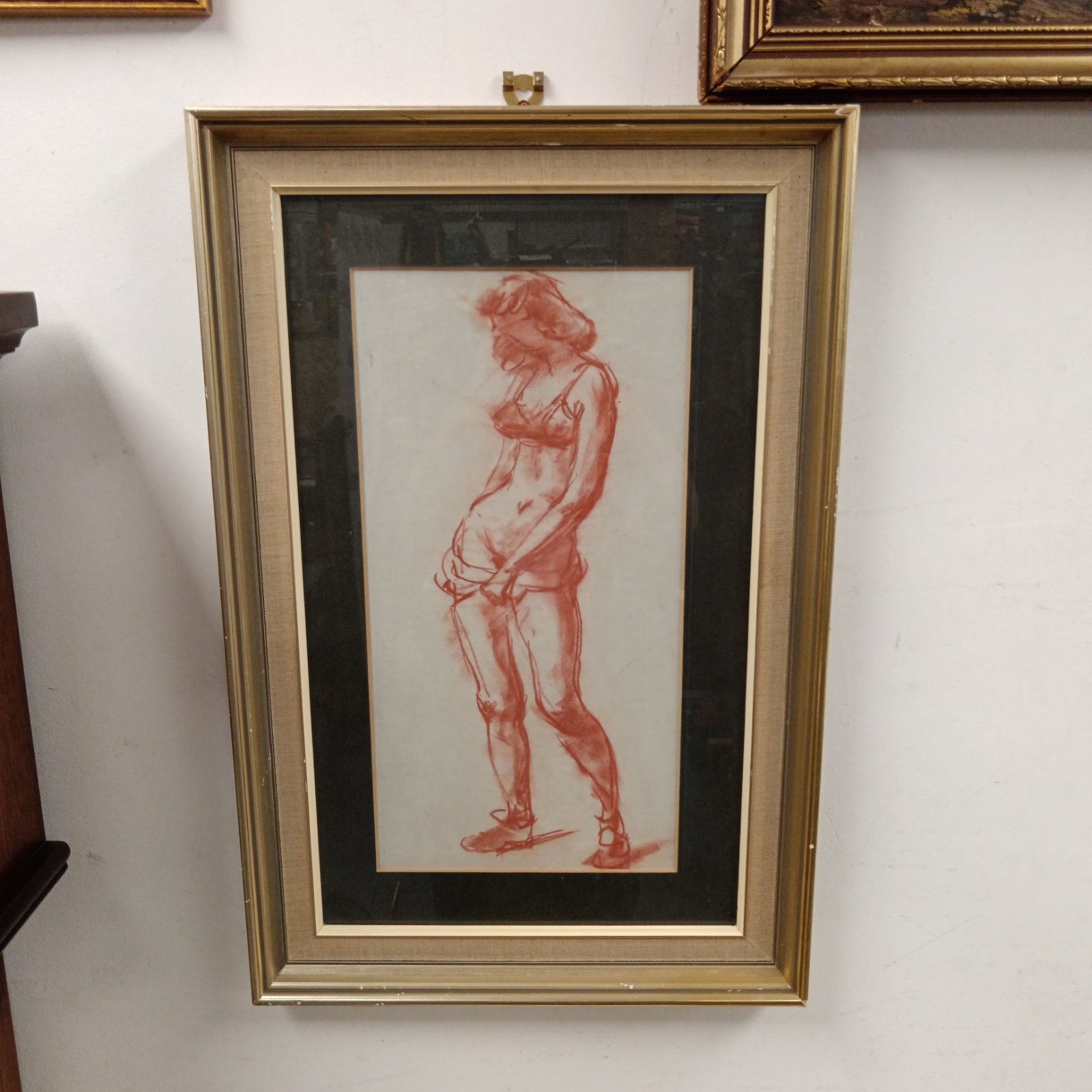 Stella Steyn sanguine chalk study of a nude female figure.