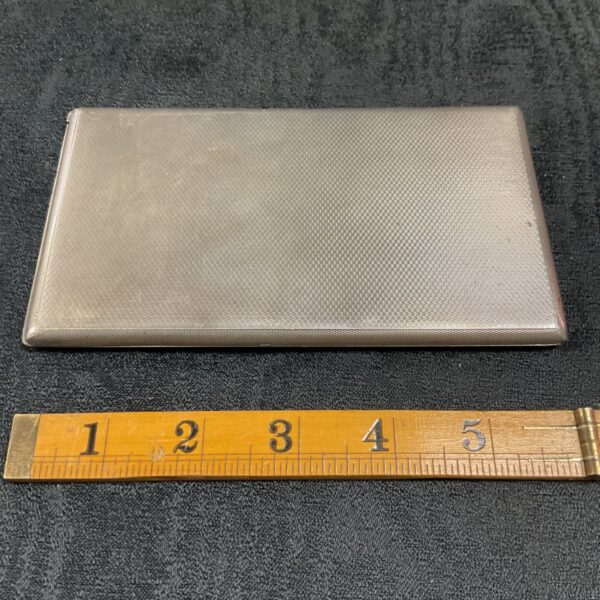 Vintage sterling silver cigarette case with engine turned detail.