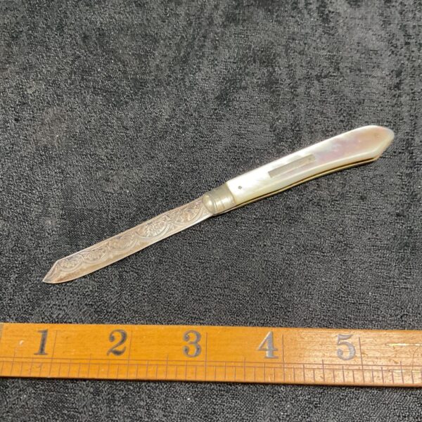 Antique sterling silver fruit knife with mother of pearl handle.