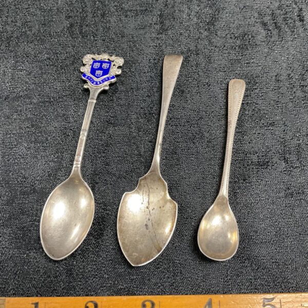 Lot of three vintage sterling silver spoons with hallmarks.