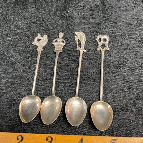 Set of four sterling silver collectible teaspoons with animal finials.