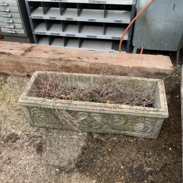 Weathered stone effect garden planter for outdoor plants.