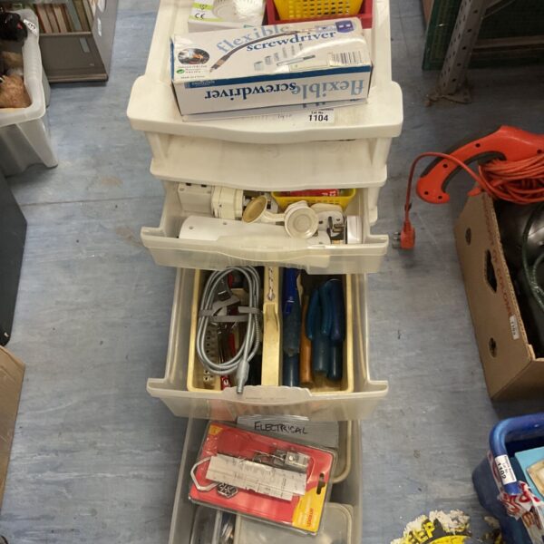 Full view of the storage drawer unit with assorted tools.