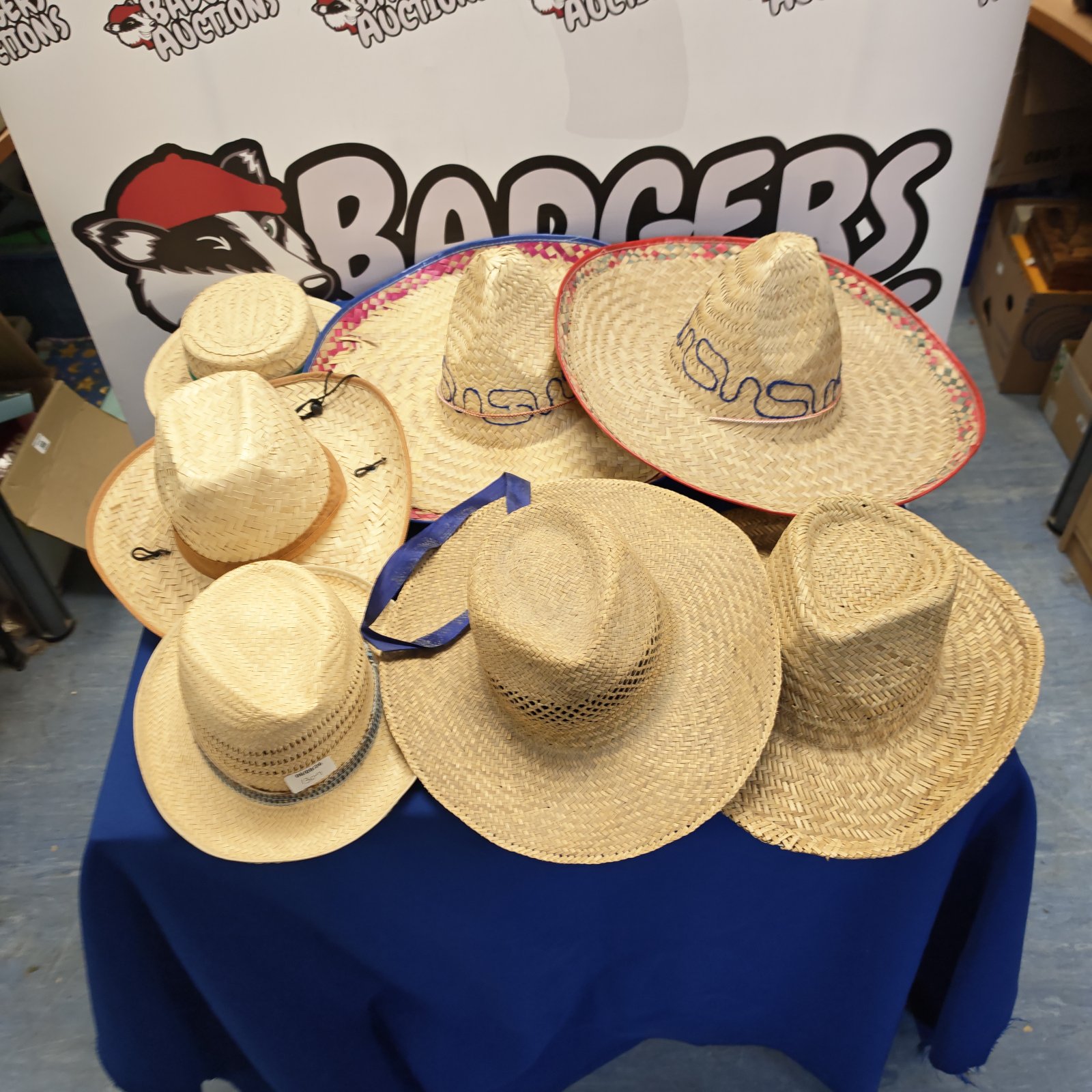 Selection of colourful straw hats and sombreros on display.