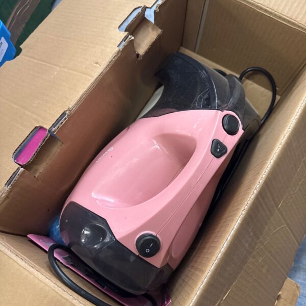 Pink Swan Lyndsey handheld vacuum cleaner inside cardboard box.