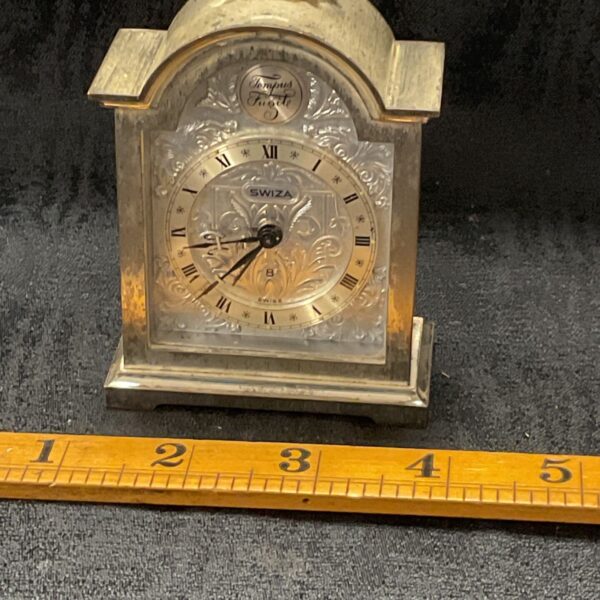 Antique Swiza silverplated carriage clock with Roman numeral dial.
