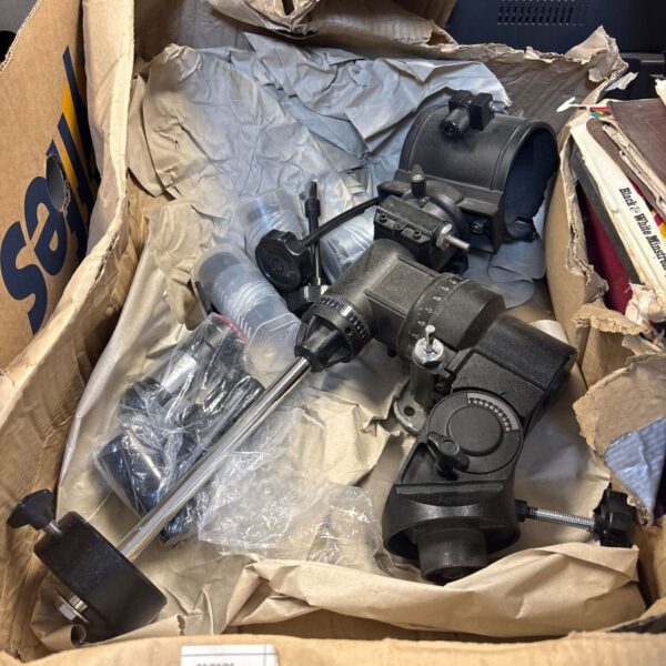 Vintage telescope accessories including an equatorial mount component.