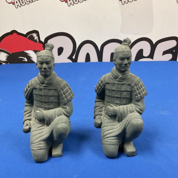 Pair of Mike O’Toole terracotta warrior figures, detailed sculptures.