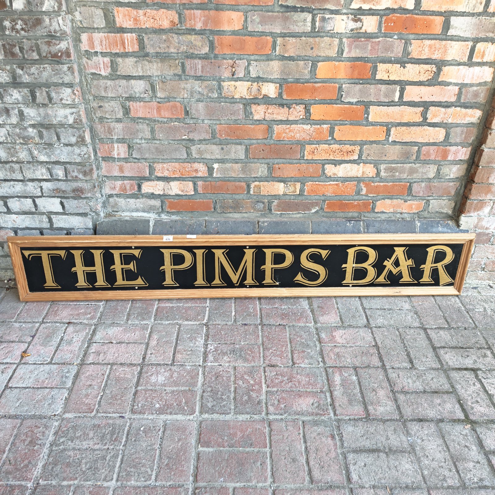 Vintage “The Pimps Bar” sign, a unique retro pub decoration.