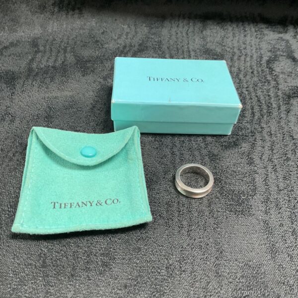 Tiffany & Co. silver ring with box and pouch.