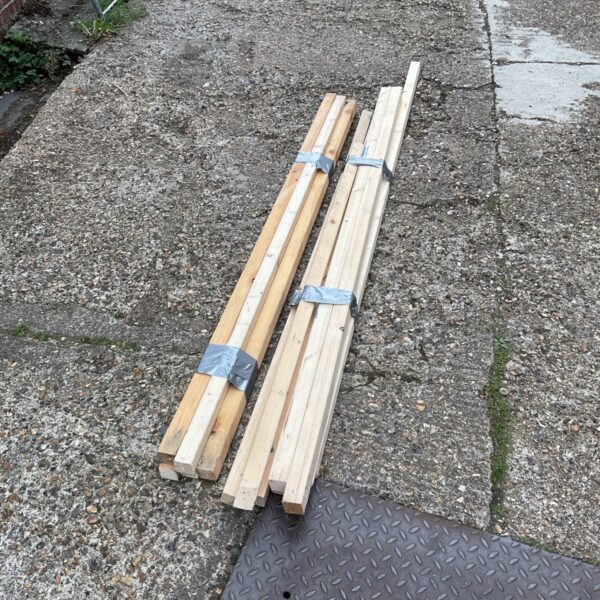 Bundles of 2x2 timber for DIY projects.