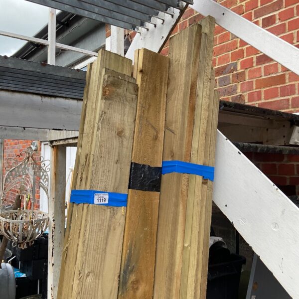 Three bundles of 7ft timber stacked outdoors, ready for use.