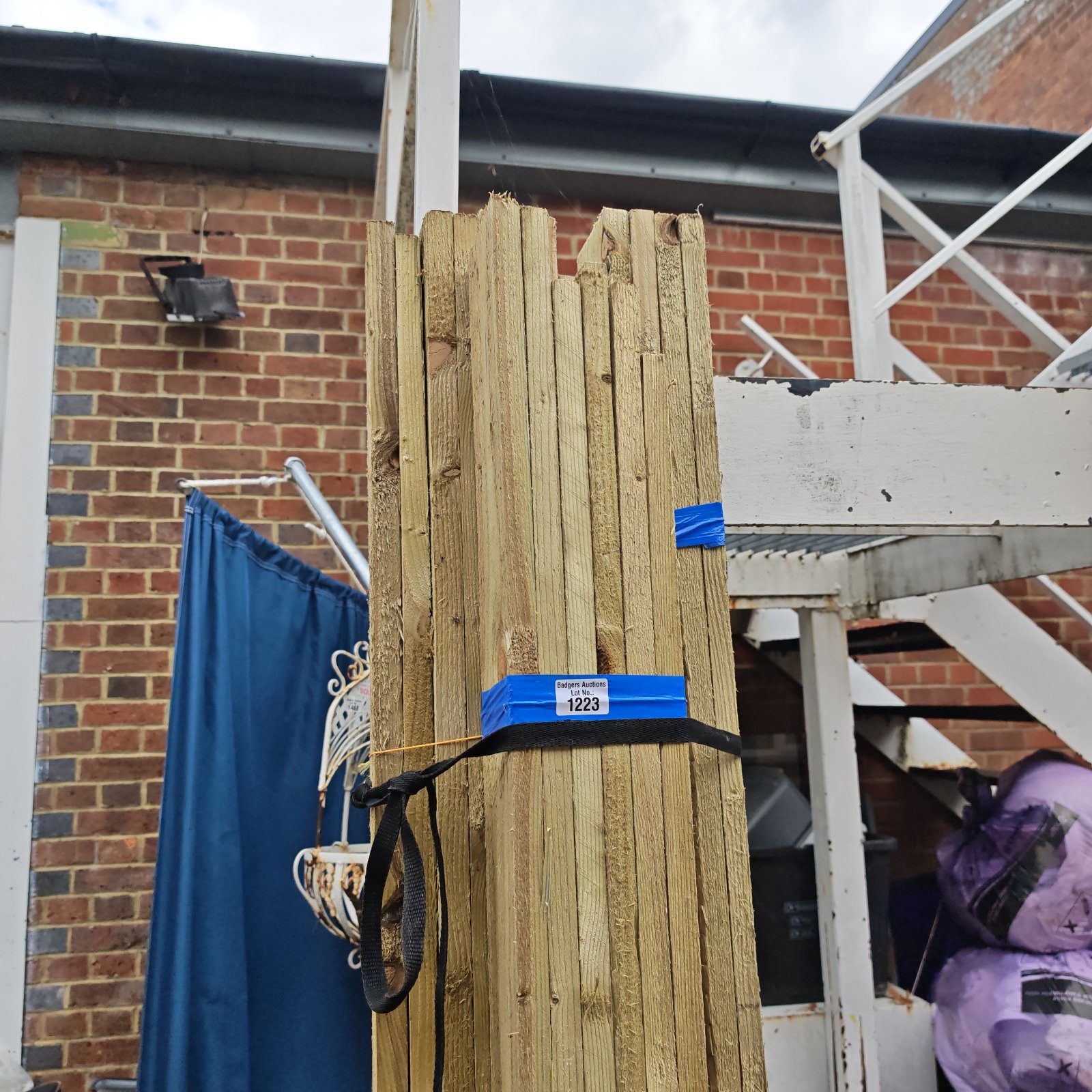 Stacked bundles of 7ft timber for construction and DIY projects.