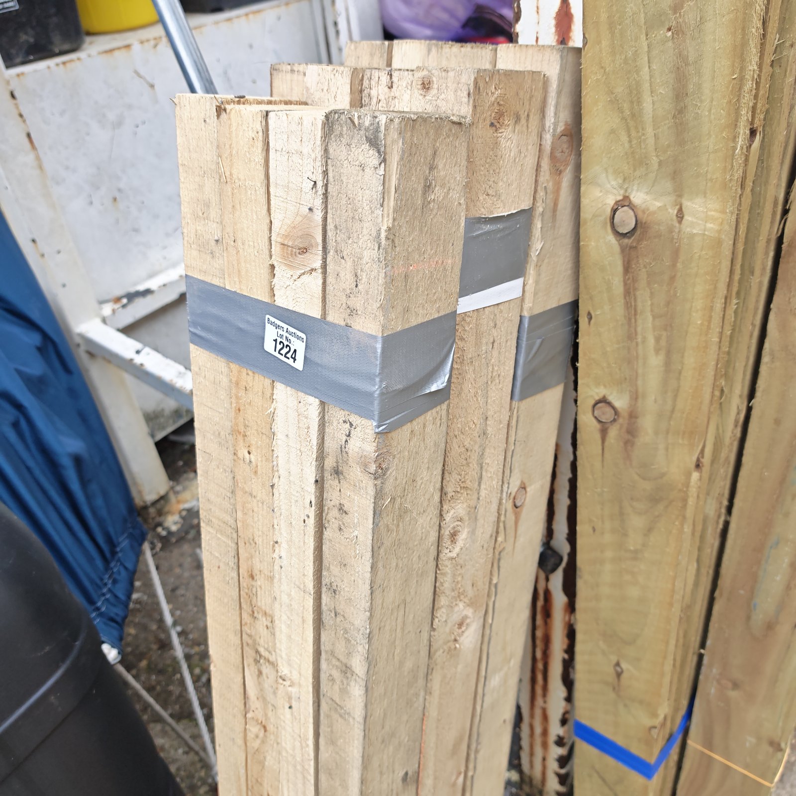 Stacked bundles of 4ft timber for construction and DIY projects.