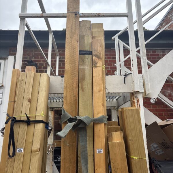 Strapped bundles of timber ready for construction or DIY projects.