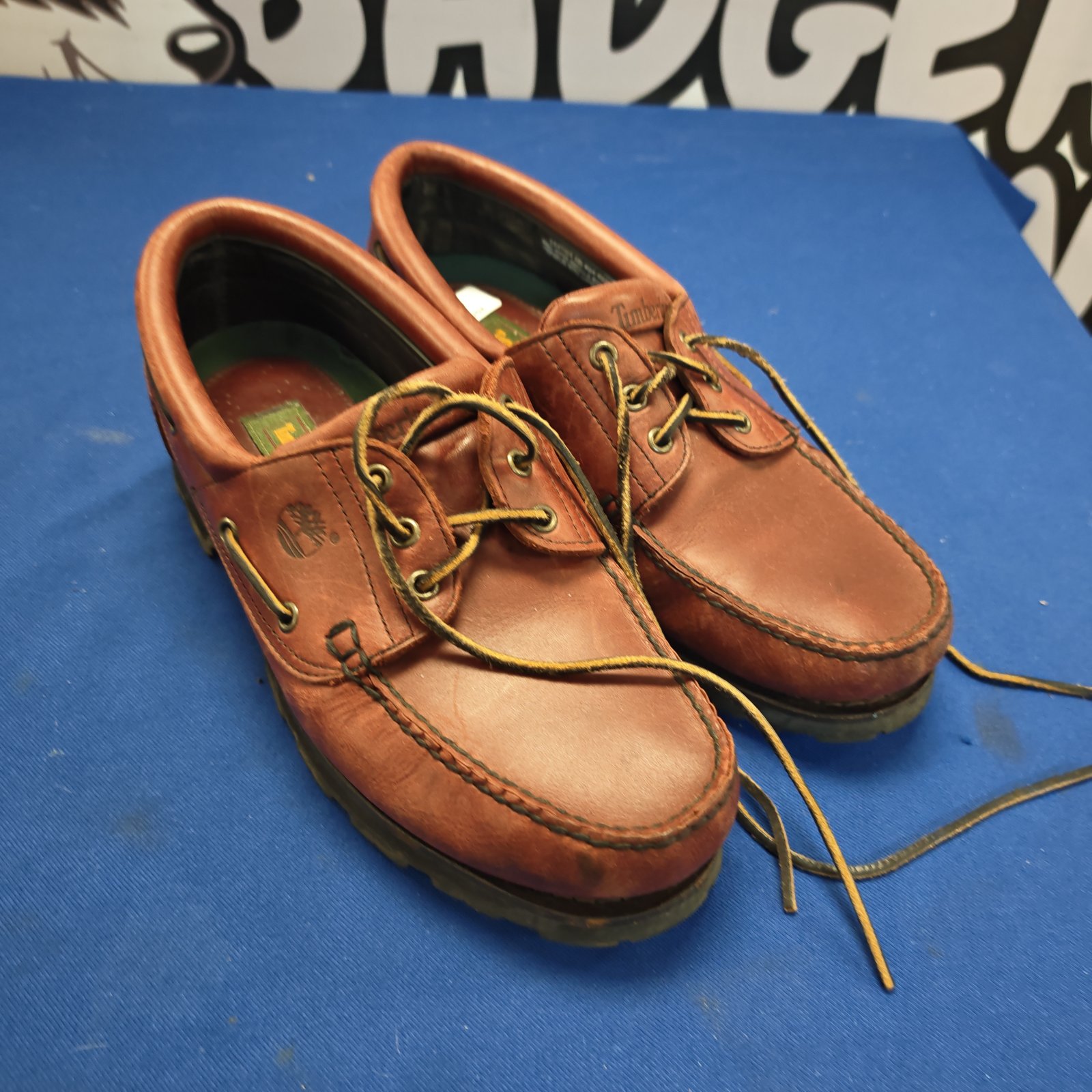 Burgundy Timberland boat shoes size 11, classic leather footwear.