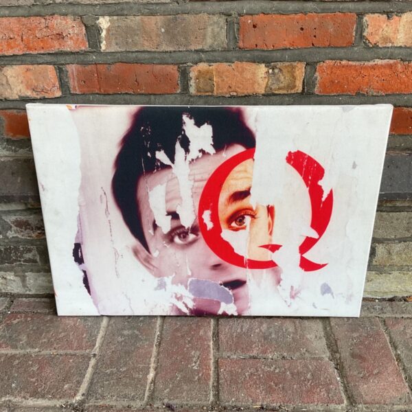 Modern canvas print of a torn portrait with a red Q.