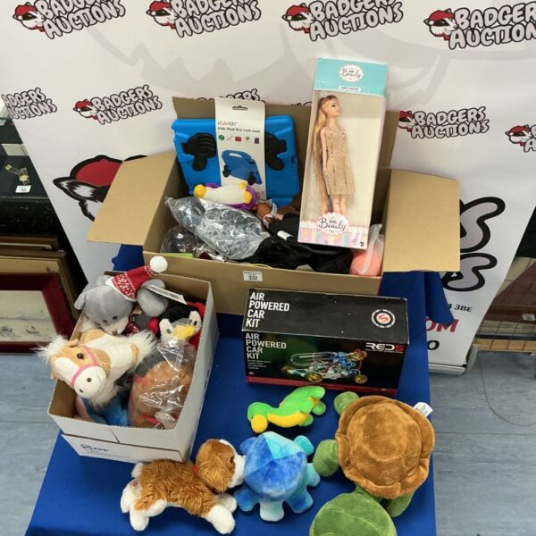 Mixed toy bundle with soft toys and car kit.