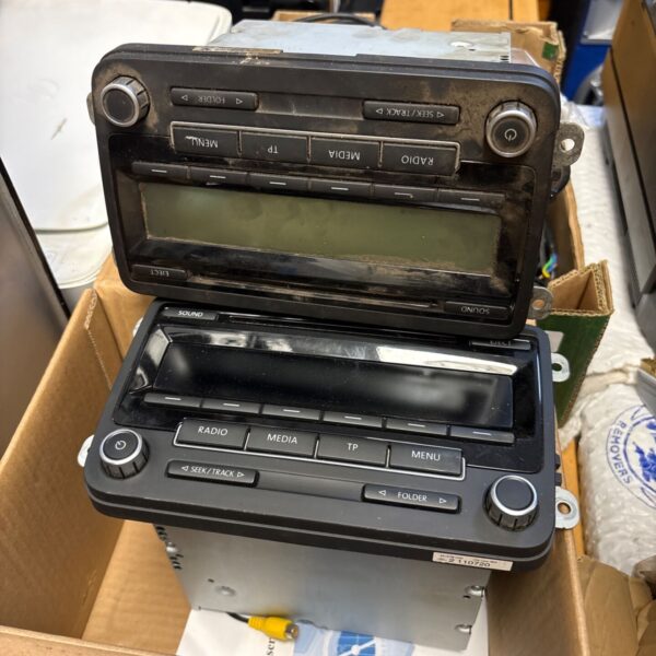 Toyota Hilux car stereo unit with CD player and radio controls.