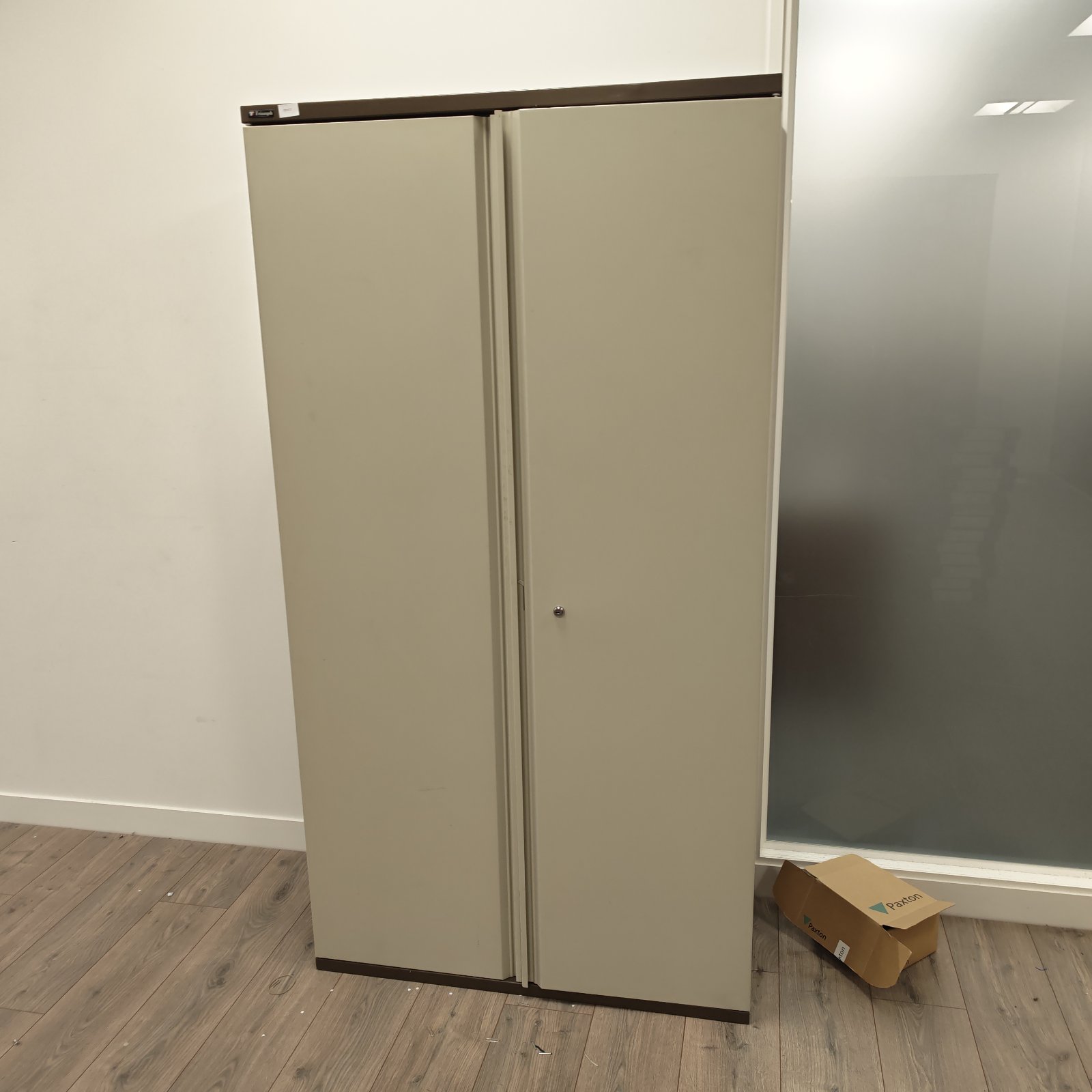 Front view of a vintage Triumph metal filing cabinet.