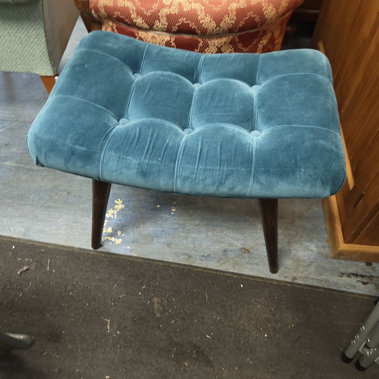 Turquoise vintage dressing table stool with button detailing.