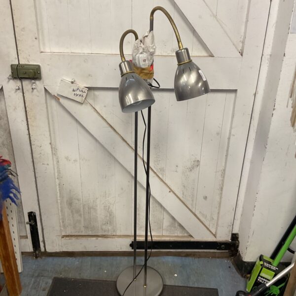 Gunmetal twin swan neck floor lamp for reading and task lighting.
