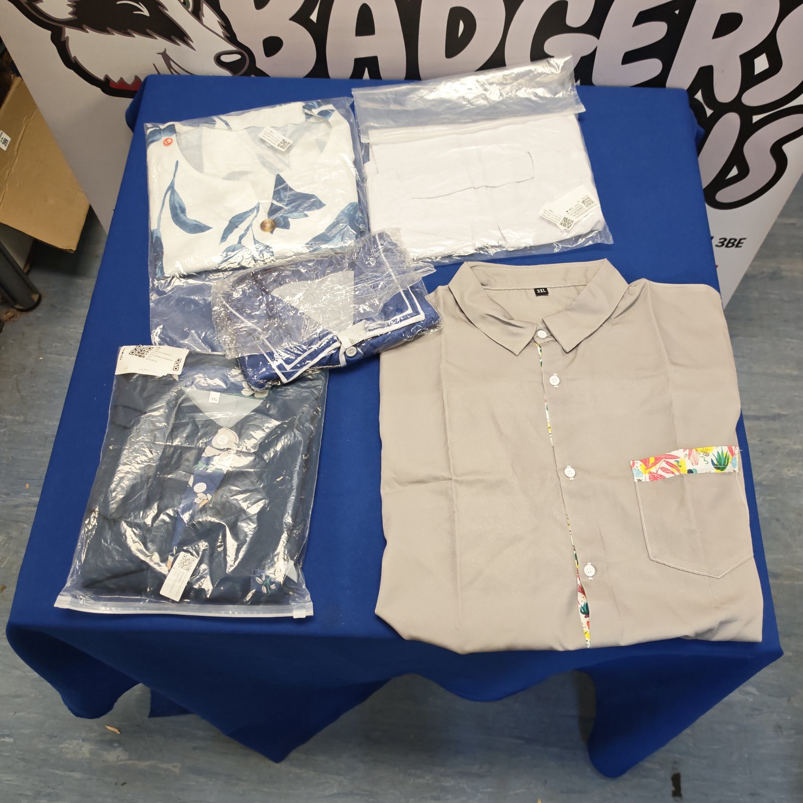 Unused 3XL shirts and blouses in a bulk lot, ready for resale.