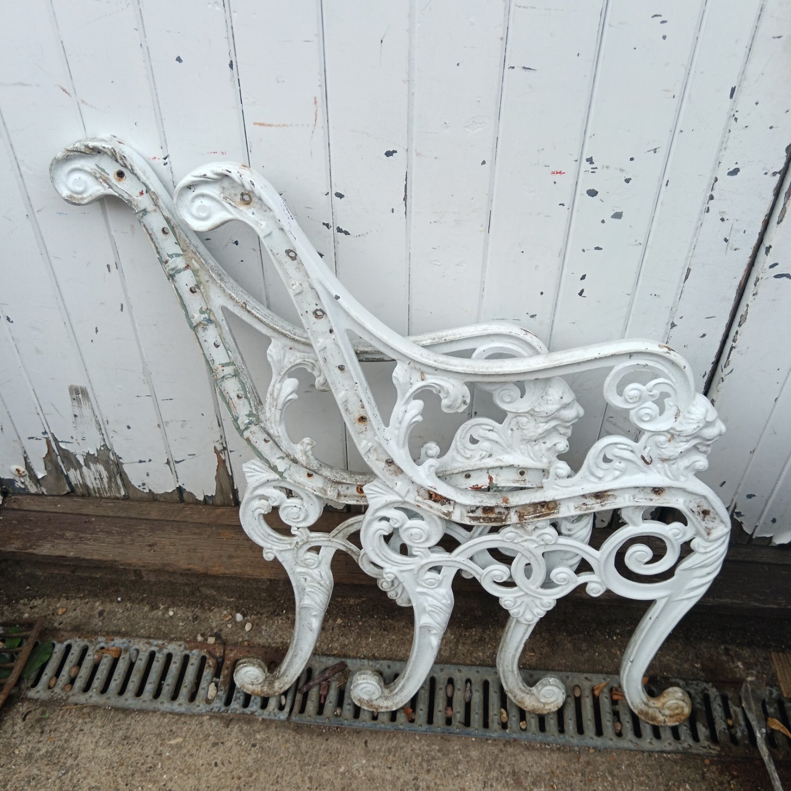 Intricate Victorian aluminium bench ends for garden restoration.