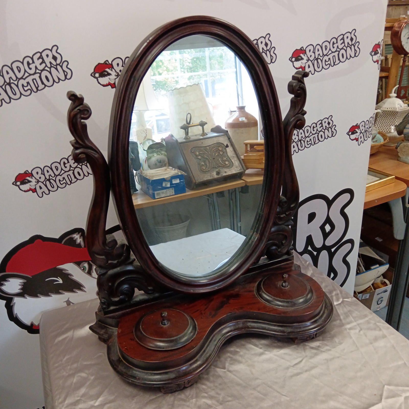 Antique Victorian mahogany dressing table mirror with oval glass.