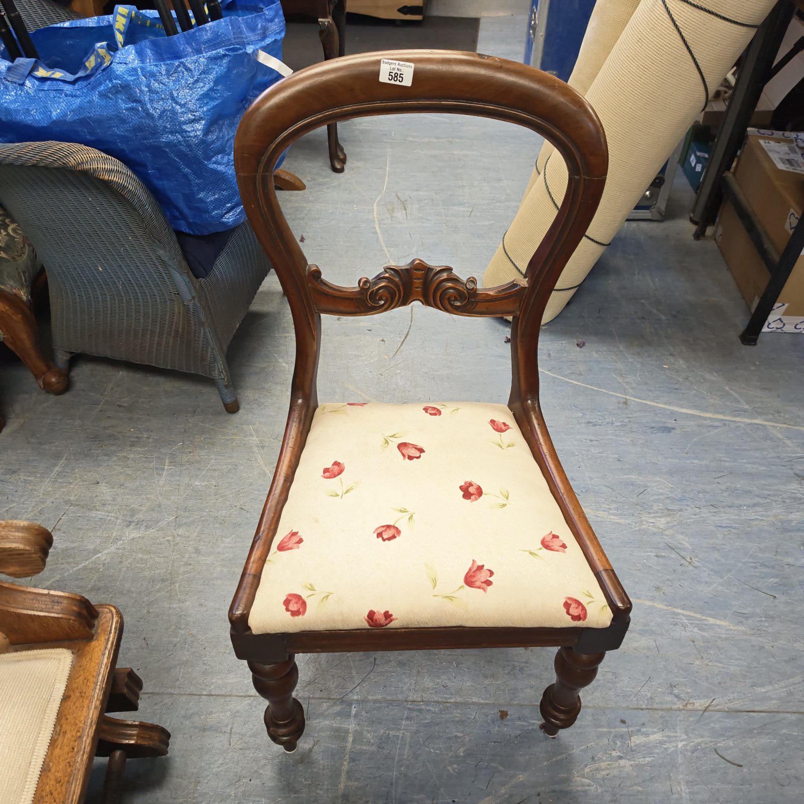 Antique Victorian mahogany side chair with floral upholstery.