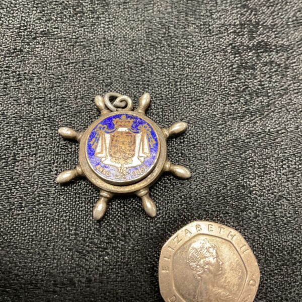 Victorian silver ships wheel brooch with 1851 enamel crest.