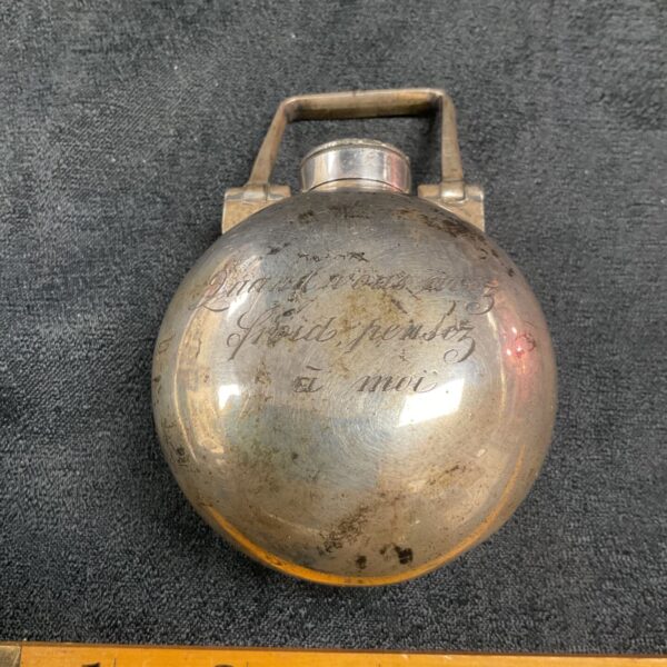 Antique Victorian silver muff warmer with handle and hinged cap.