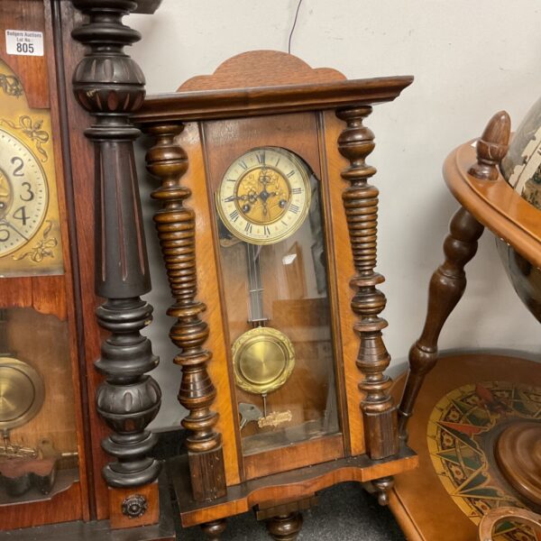 Antique Vienna wall clock in mahogany and walnut casing.