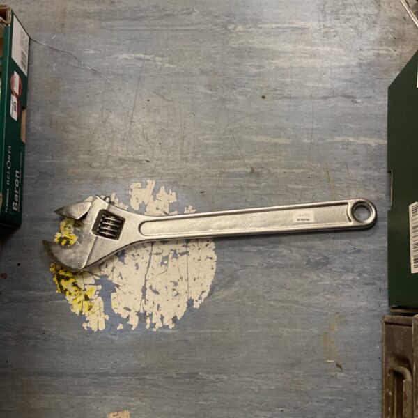 Vintage 24 inch adjustable wrench, showing signs of age and use.