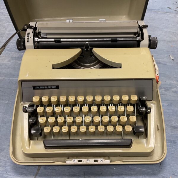 Vintage Adler mechanical typewriter in a classic retro style.