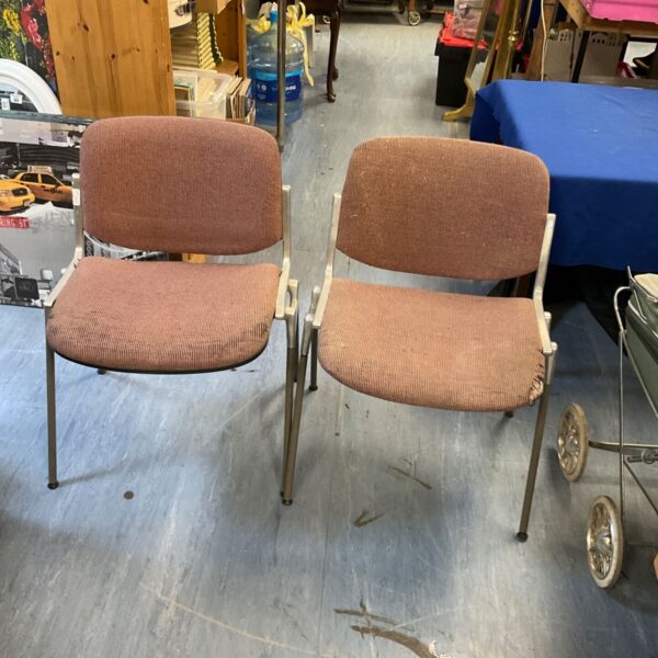 Vintage Anonima Castelli designer chairs with textured upholstery.