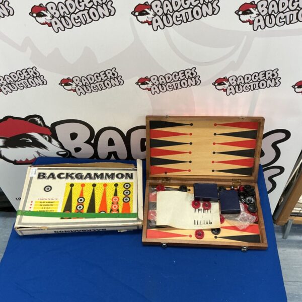 Open vintage backgammon set showing the playing surface and pieces.