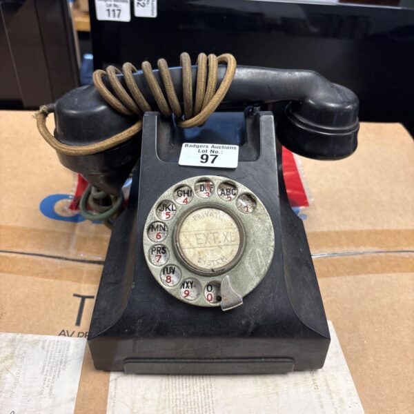 Vintage black Bakelite rotary dial telephone for collectors.