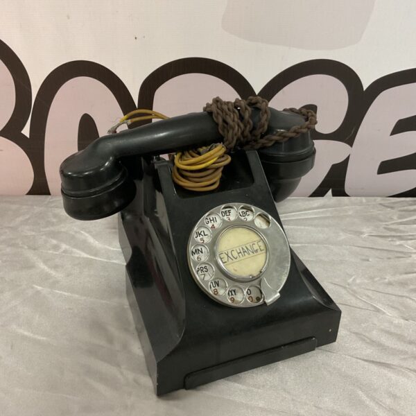 Vintage black Bakelite rotary telephone, classic retro design.