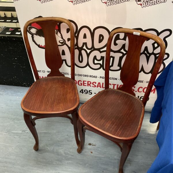 Pair of vintage J and J Kohn bentwood chairs with curved backs.