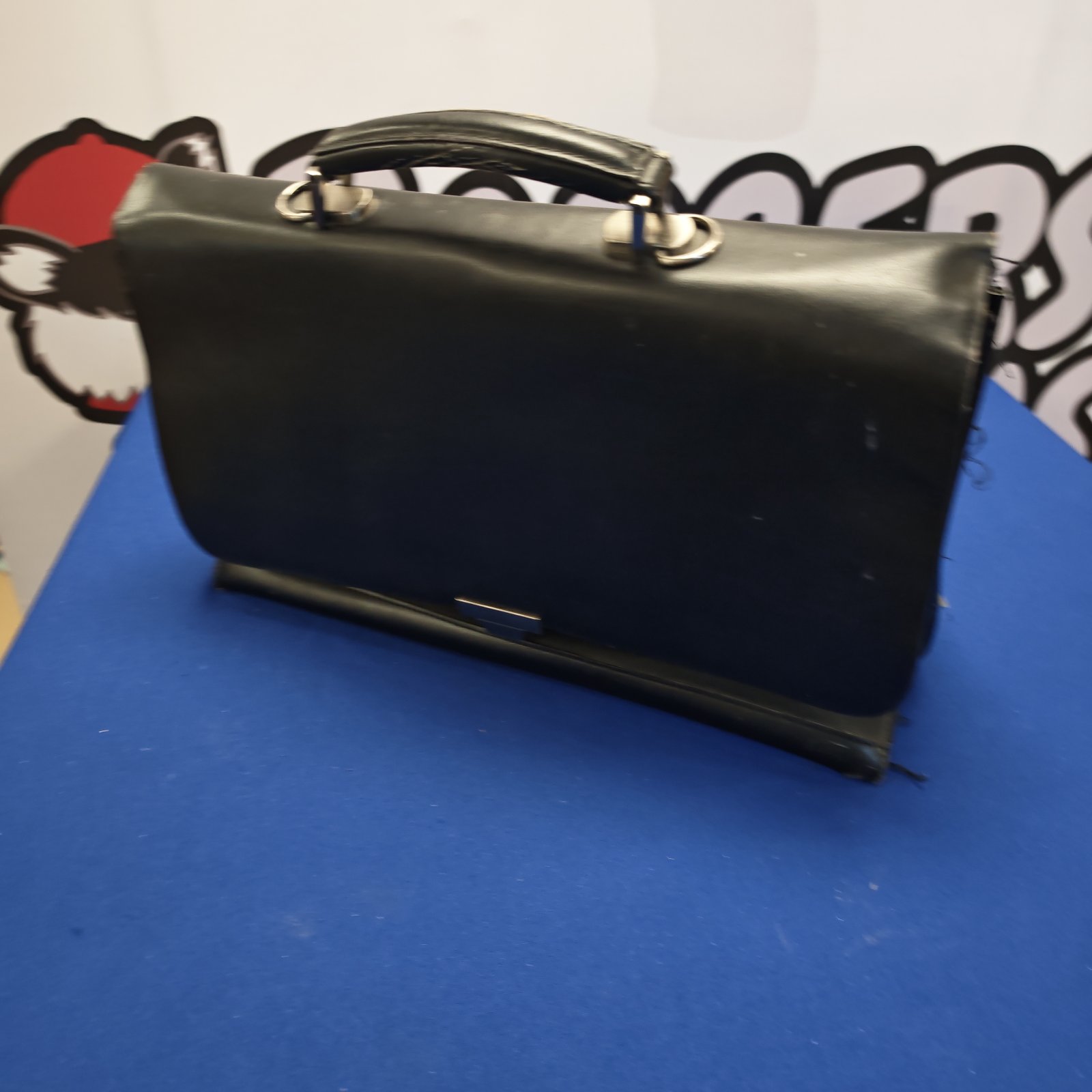 Vintage black leather briefcase, classic retro style bag.